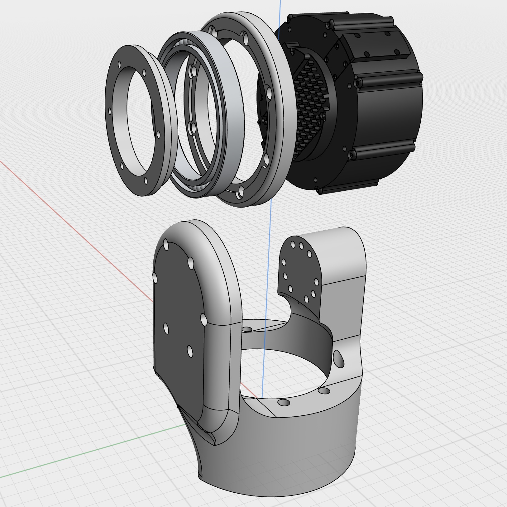 Exploded view of a joint assembly showing motor, bearings, and housing