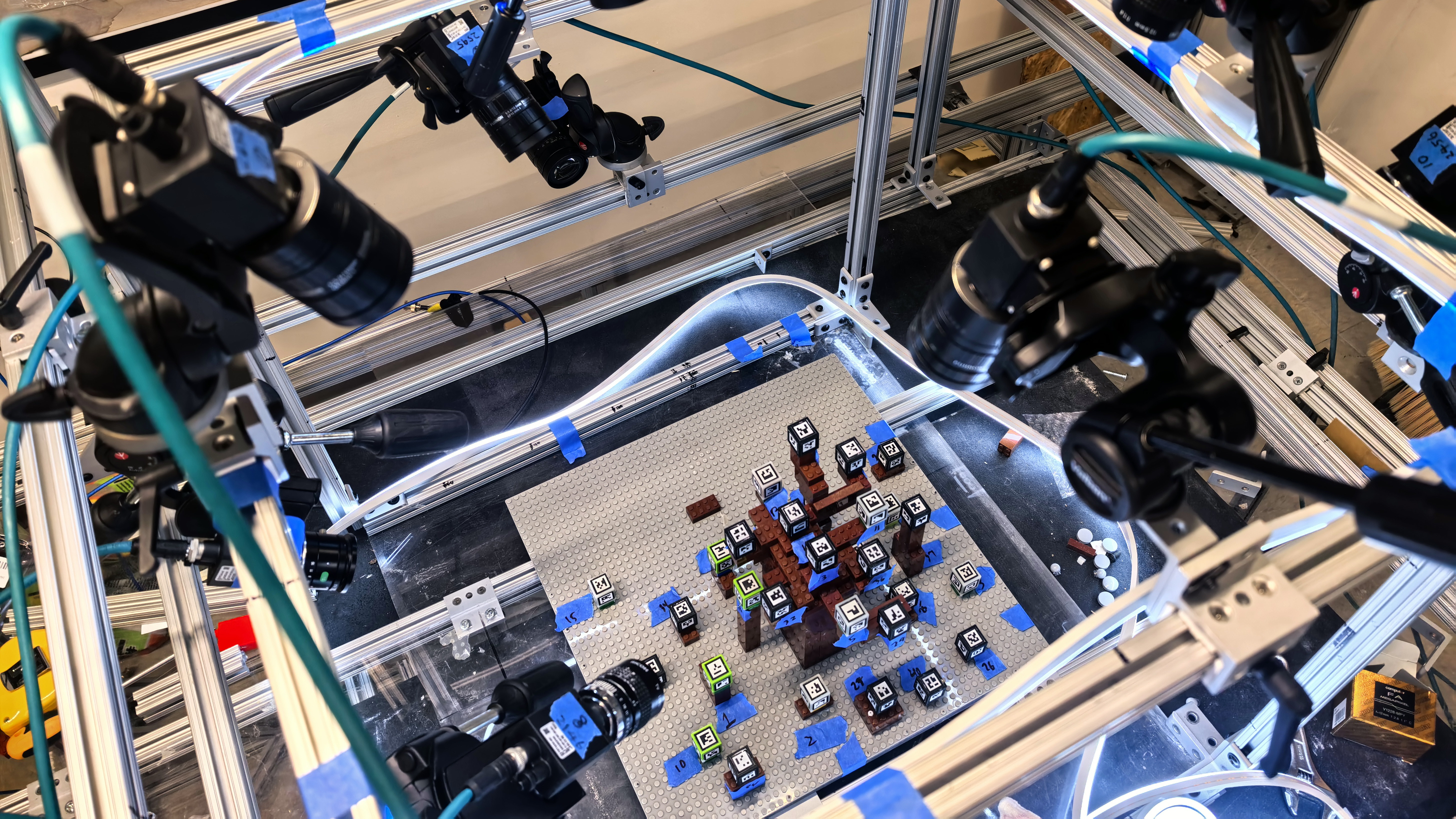 The generation 2 camera arena, with cameras mounted around an aluminum frame pointed at the instrumented baseplate