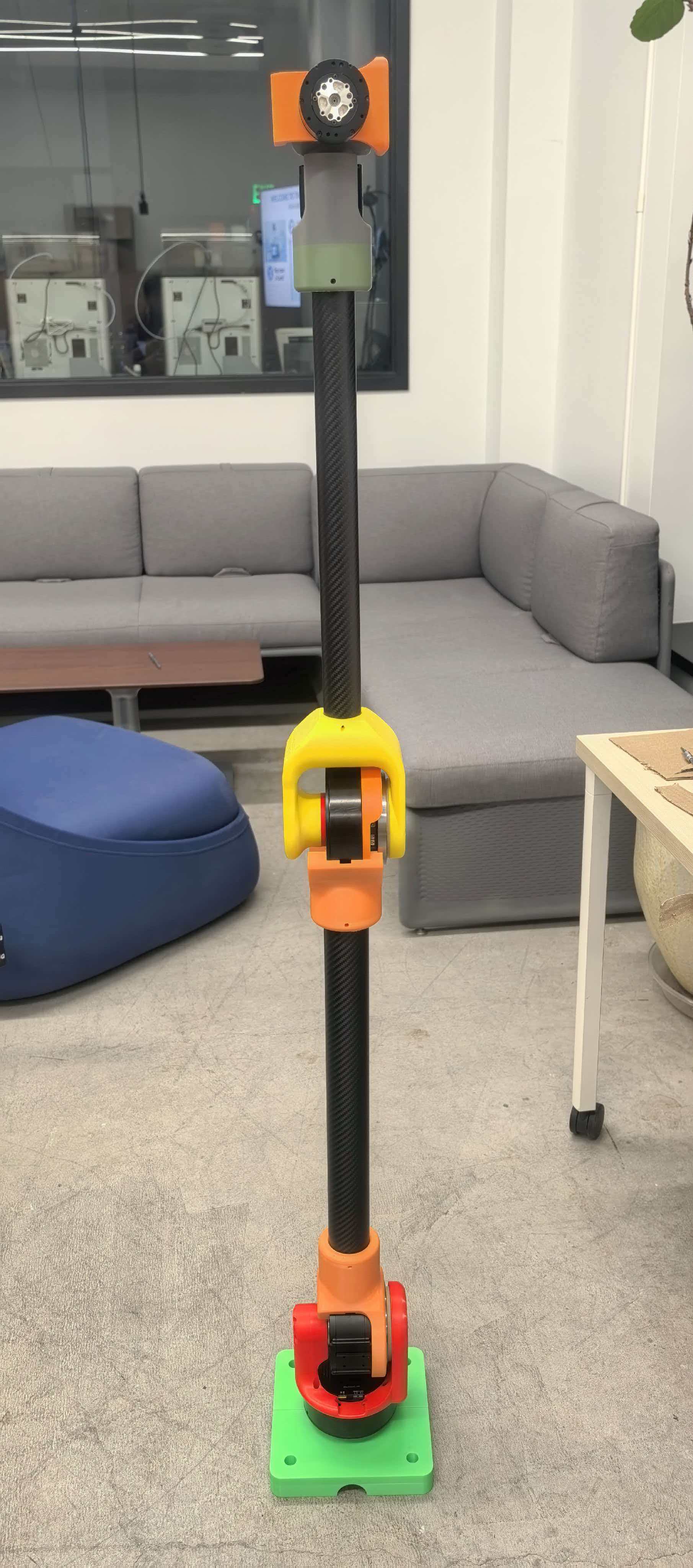The Iteration 4 arm assembled and standing, with 3D-printed joints and carbon fiber links